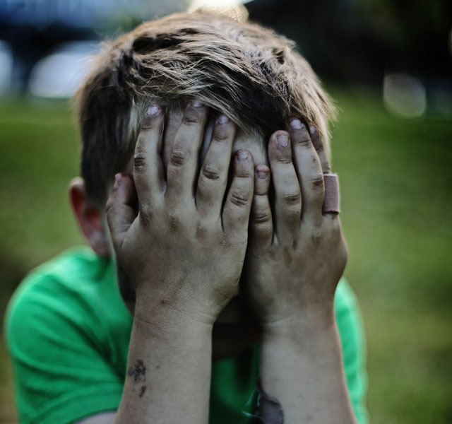 Child Weeping After a School Shooting